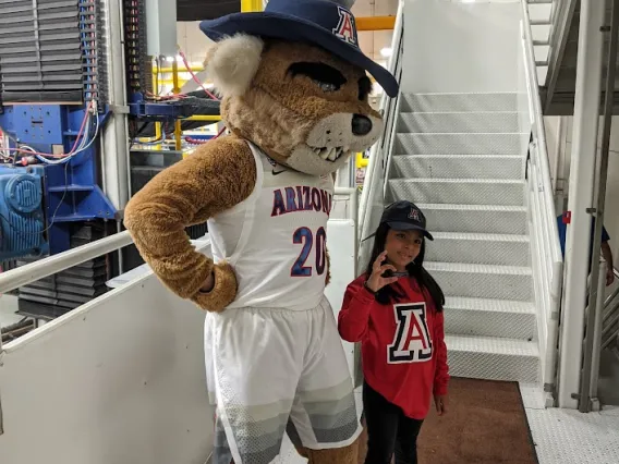 Young girl with Wilbur Wildcat