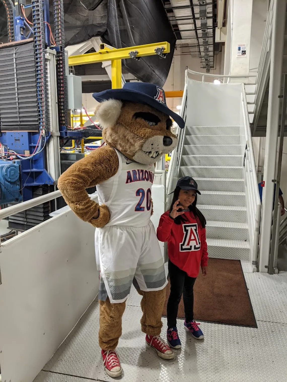 Young girl with Wilbur Wildcat