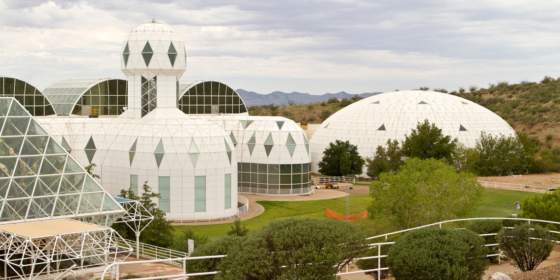 Image of Biosphere 2, a large white domed building.