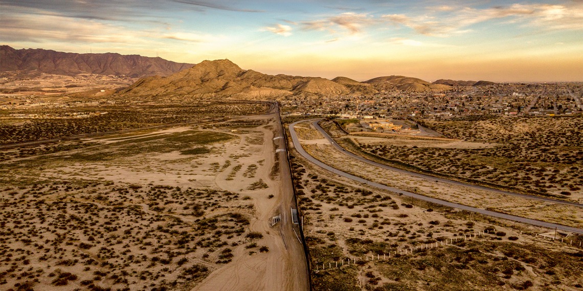 Aerial view of the border wall stretching through the desert.