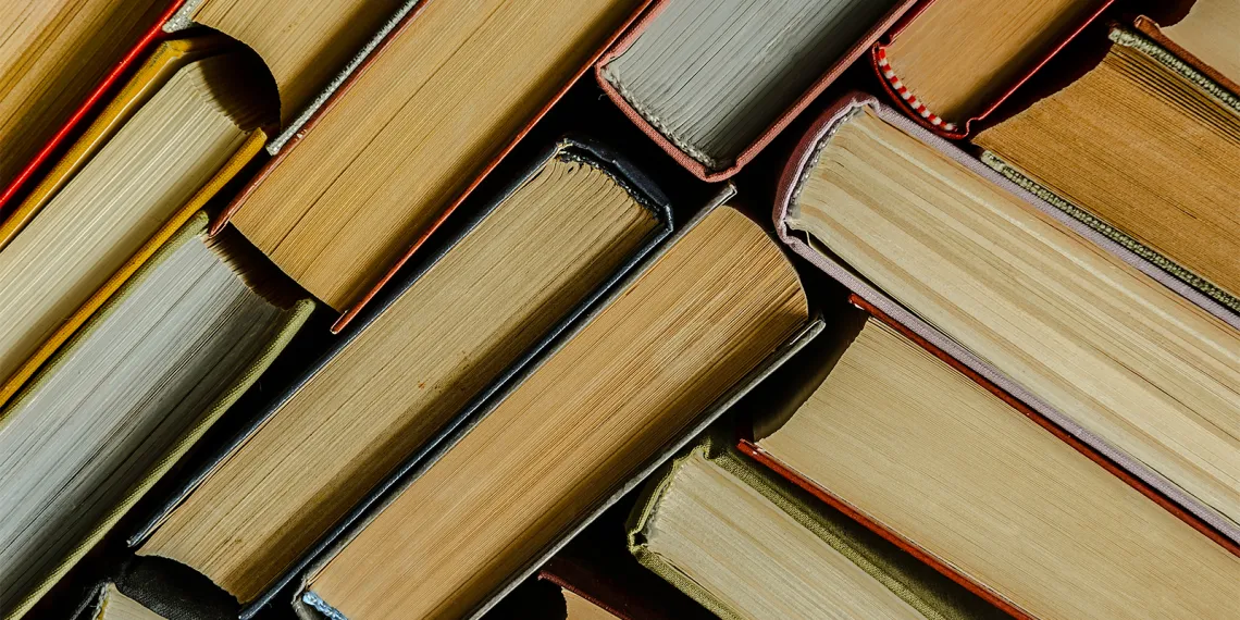 A stack of colorful books in a library.